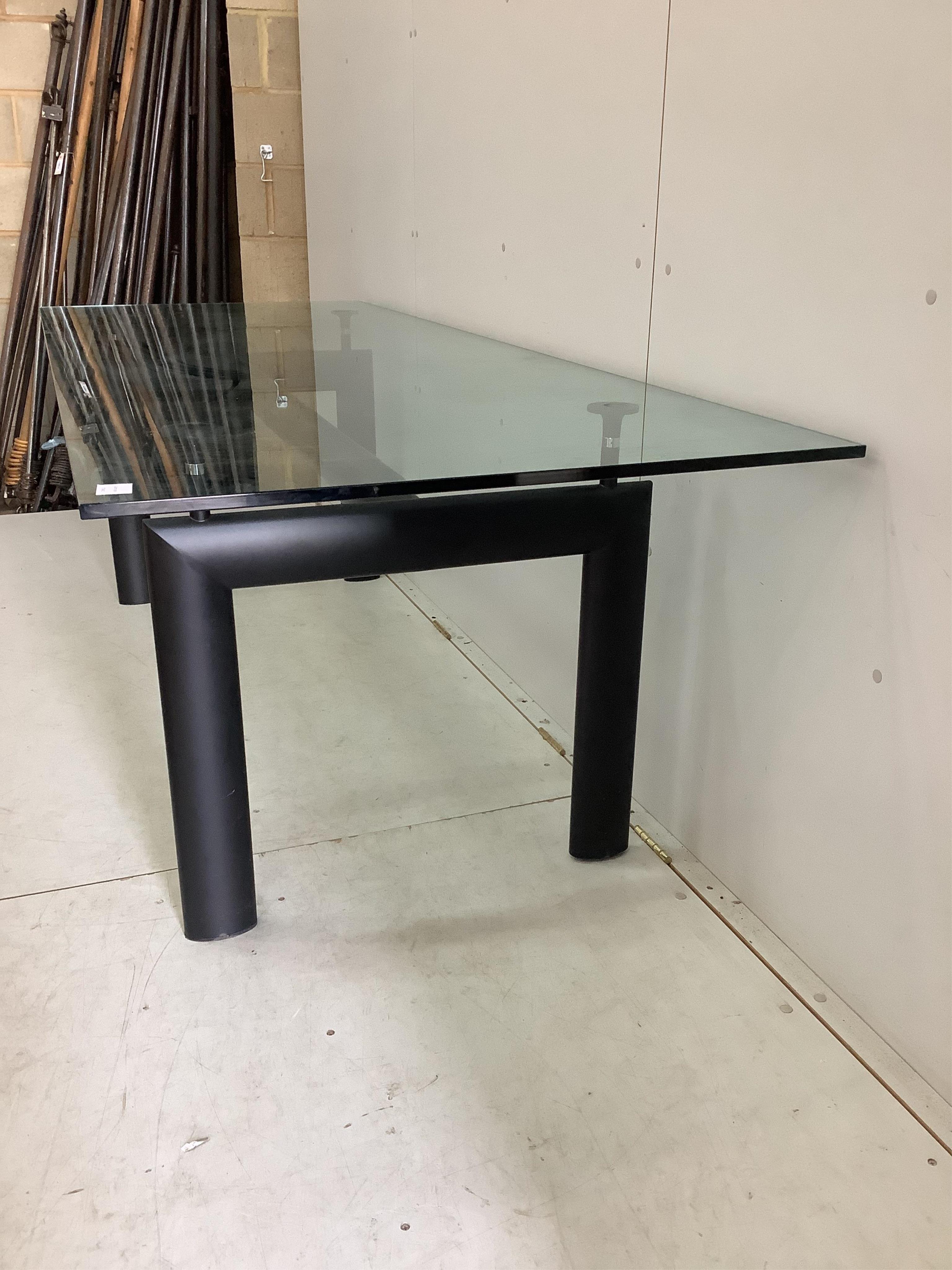 A Corbusier design LC6 style dining table with glass top, width 225cm, depth 85cm, height 72cm